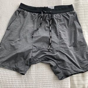 Gray Nike running shorts in medium